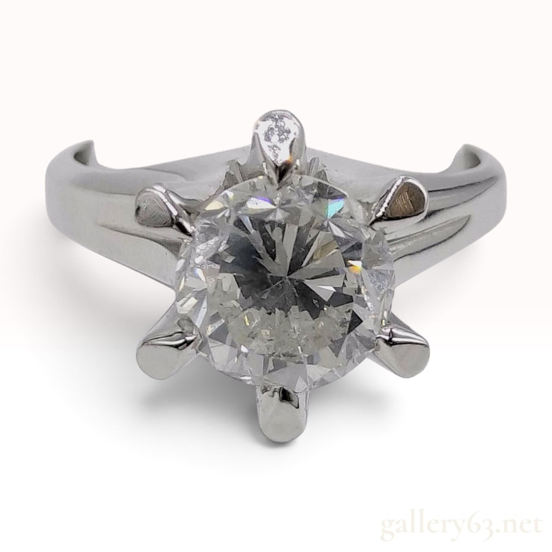 1.953ct Natural G-I1 Diamond Pt900 Solitaire Ring W/Central Gem Laboratory Report: This solitaire ring is crafted from Pt900 platinum and features a large round brilliant-cut natural diamond. The center stone weighs 1.953ct and is secured in a classic six-prong setting above a wide 