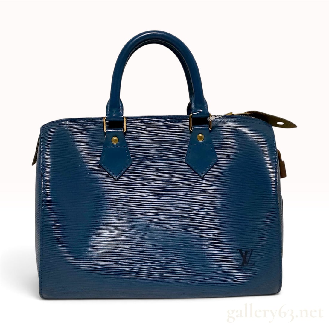 Vintage Louis Vuitton Speedy 30 Toledo Blue Epi Leather Top Handle Bag: This Louis Vuitton Speedy 30 is crafted from Toledo Blue Epi leather, featuring a structured duffle-style silhouette and dual rolled leather handles. The exterior is characterized by the distinctive h