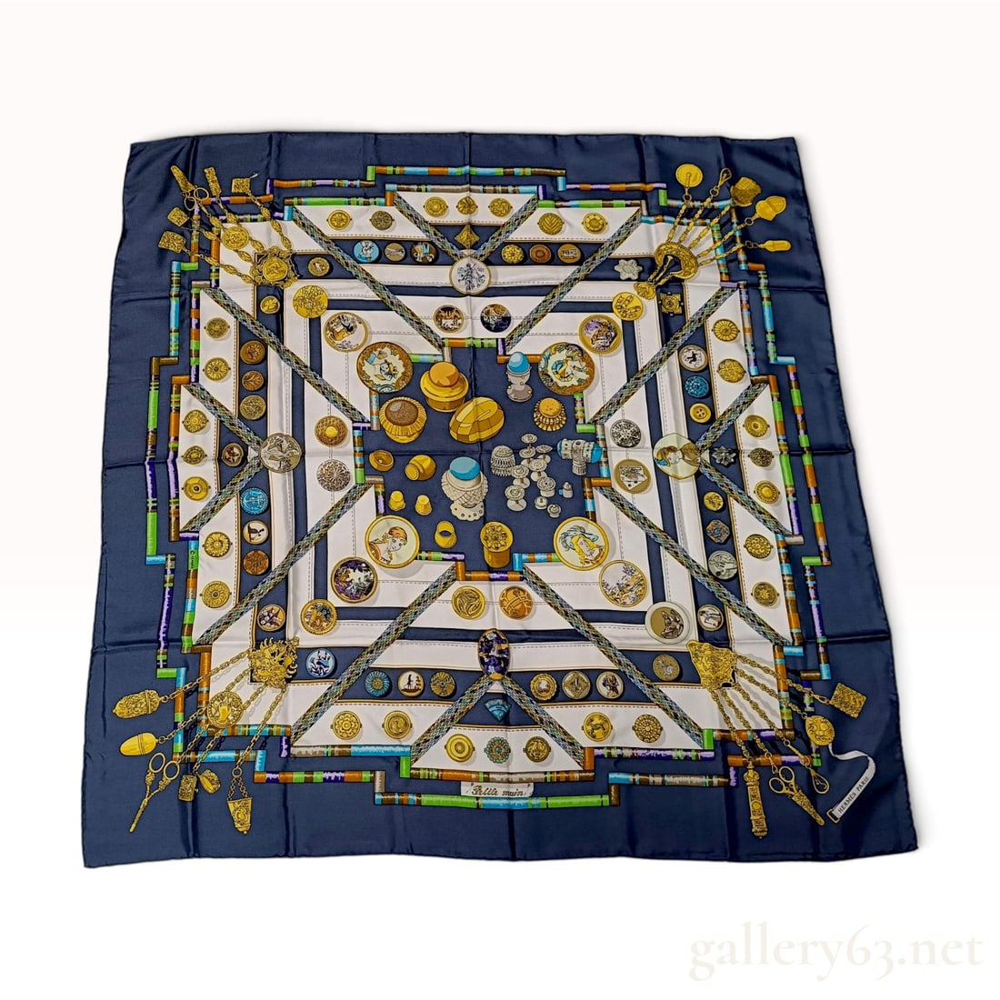 Vintage Hermes Petite Main Blue and White Silk Carre 90: This Hermes silk carre 90 crafted from silk twill features the Petite main design by Caty Latham. The haberdashery-themed pattern displays a central collection of sewing notions including gold-tone th