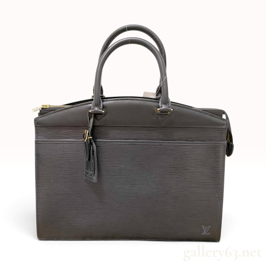 Vintage Louis Vuitton Riviera Black Epi Leather Handbag: This Louis Vuitton Riviera handbag is crafted from black Epi leather featuring a signature textured linear grain. The structured professional bag is designed with smooth leather trim, dual rounded top