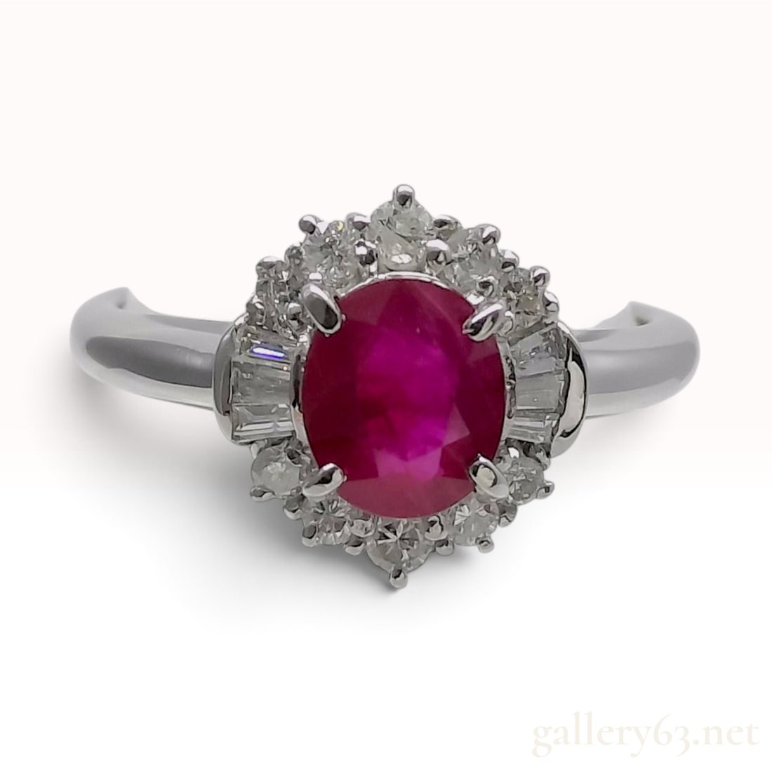 Pt900 1.07ct Natural Ruby and 0.30ctw Natural Diamond Halo Ring with CGL Report: A newly finished cocktail ring crafted from polished Pt900 platinum. The center features a 1.07ct oval-cut natural ruby displaying a vibrant purplish-red hue, secured in a four-prong setting. The ruby
