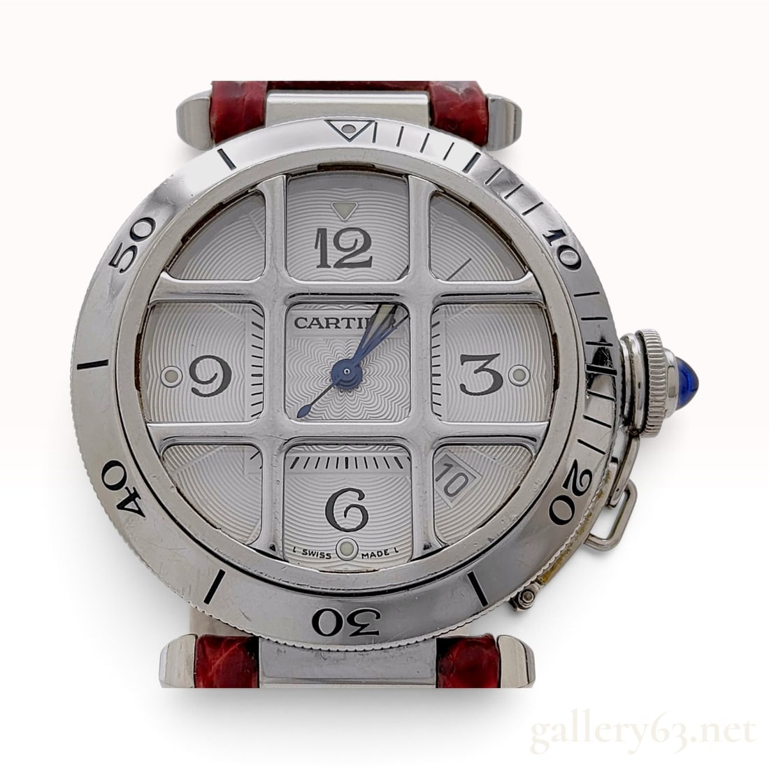 Cartier Pasha de Cartier 38mm Box&Papers Grille Stainless Steel Wristwatch: This Cartier Pasha de Cartier wristwatch is constructed from stainless steel and features a removable protective grid over a silvered guilloche dial. The dial is designed with Arabic numerals at the q