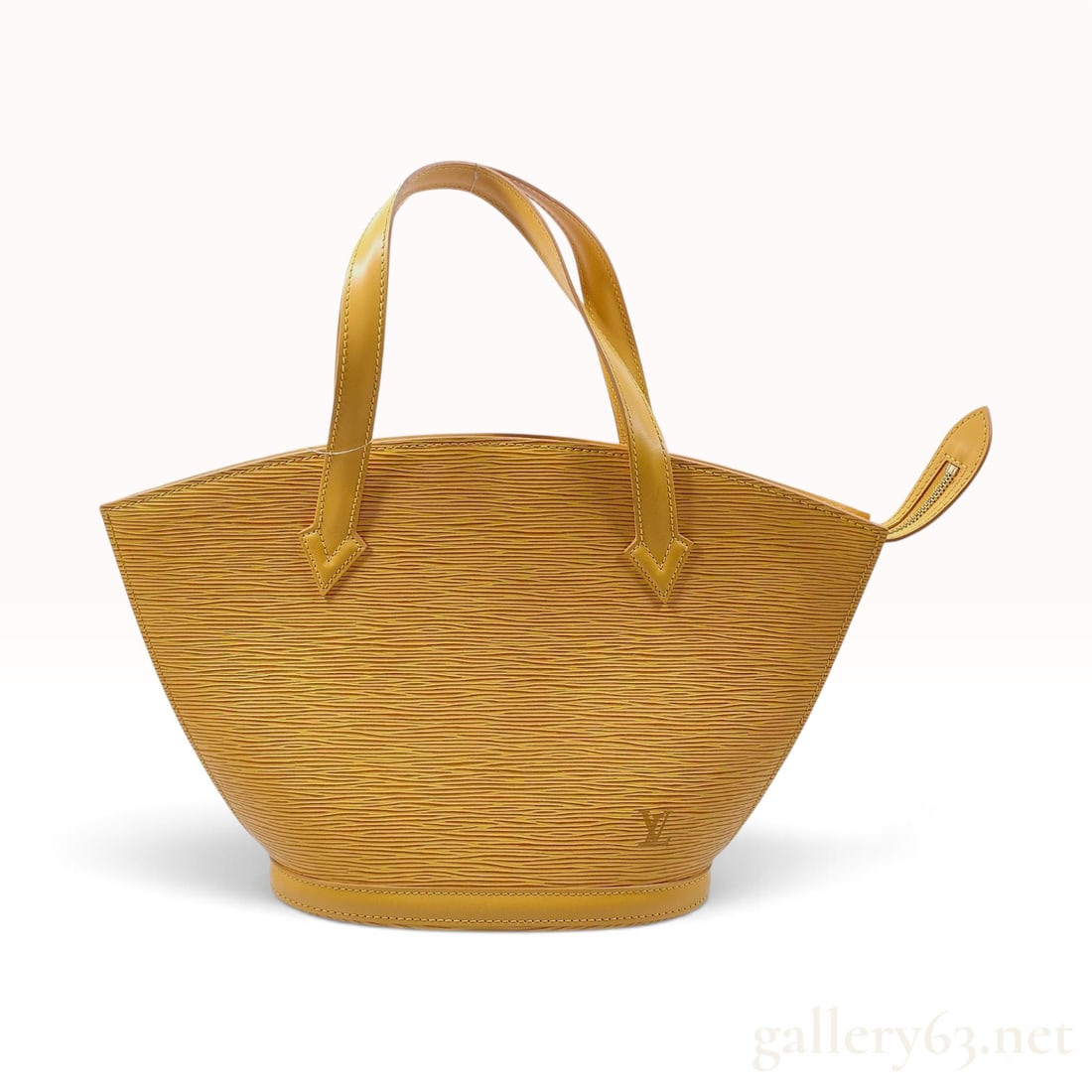 Louis Vuitton Saint Jacques Tassil Yellow Epi Leather Handbag: This Louis Vuitton Saint Jacques handbag is crafted from Tassil yellow Epi leather, distinguished by its textured horizontal wave-like grain. The bag features a broad fan-shaped silhouette that tapers