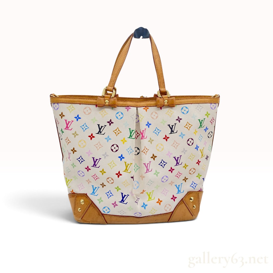 Louis Vuitton Monogram Multicolore Sharleen MM White Coated Canvas Tote Bag: This Louis Vuitton Sharleen MM tote bag is crafted from white Monogram Multicolore coated canvas, a signature collaboration between the house and artist Takashi Murakami featuring the iconic monogram 