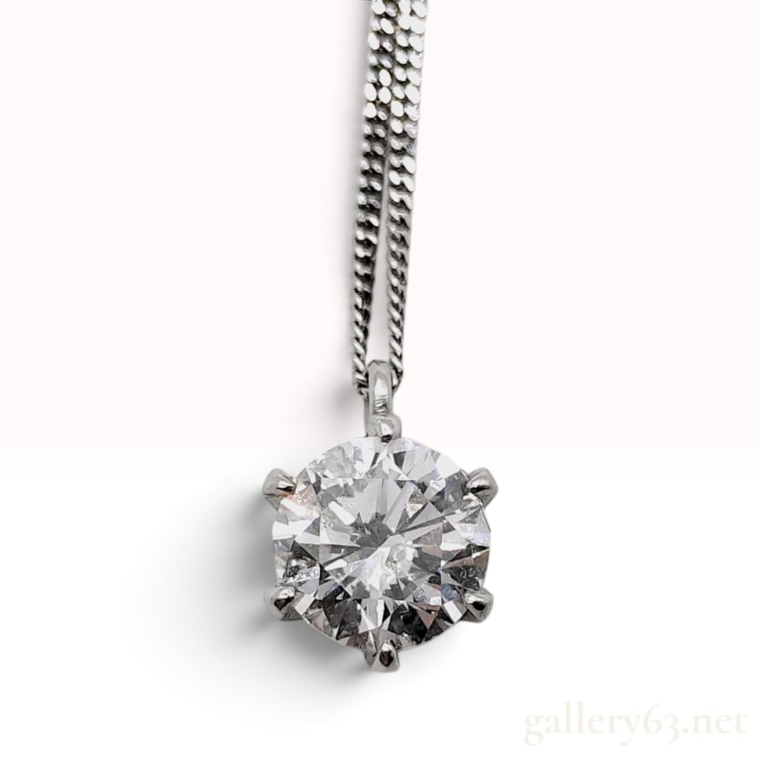 Pt900 and Pt850 Platinum 0.655ct Natural Diamond Solitaire Pendant Necklace: This platinum solitaire pendant necklace is crafted with a single round brilliant-cut natural diamond. The gemstone weighs 0.655ct and is securely held within a six-prong crown-style mounting. The pen