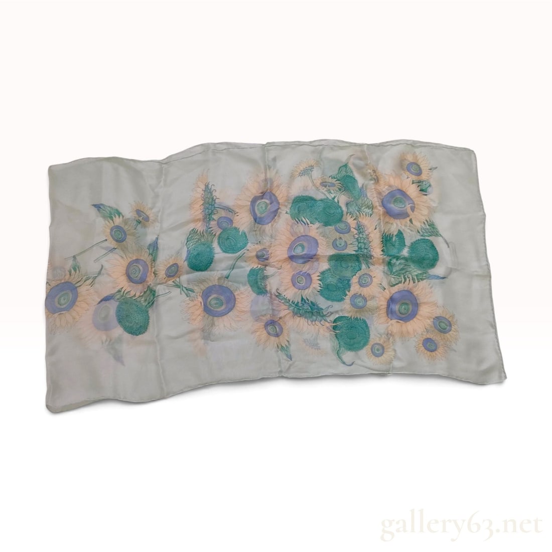 Vintage Salvatore Ferragamo Sunflower Print Mint Green Silk Rectangular Scarf: This Salvatore Ferragamo rectangular scarf is crafted from silk twill and features a large-scale floral motif. The design depicts sunflowers with pale yellow and orange petals and concentric blue and