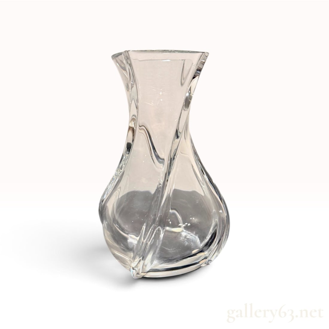 Baccarat Crystal 'Serpentin' Vase -- Signed France, Swirled Ribbed Form: A Baccarat crystal vase in the Serpentin pattern, made in France. The form is waisted at the center and flares to an undulating rim, with heavy applied crystal ribs that spiral the full height of the
