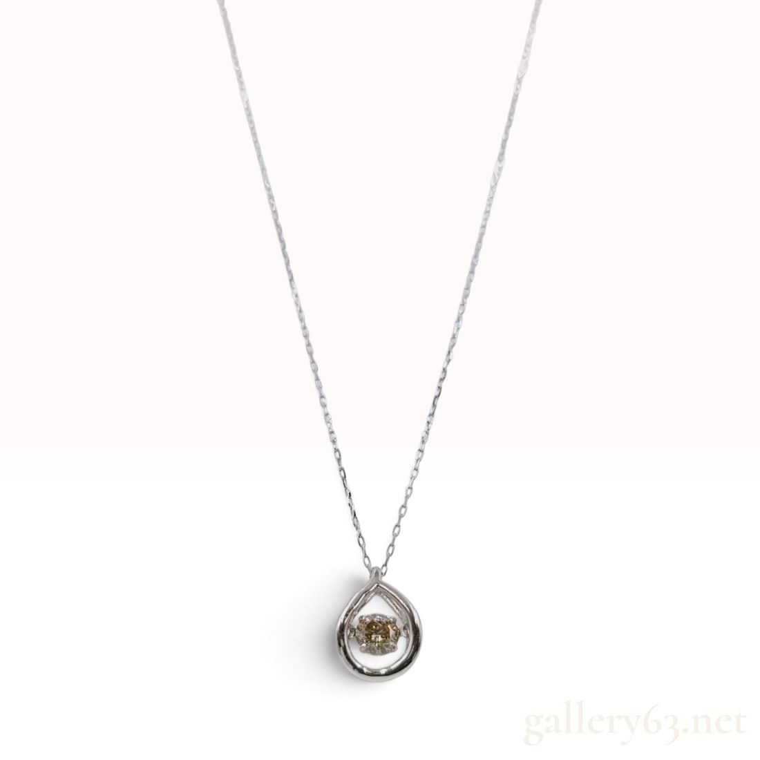 Pt900 and 0.20ct Natural Diamond Teardrop Dancing Stone Pendant Necklace: A contemporary pendant necklace featuring a teardrop-shaped Pt900 frame with a kinetic dancing stone setting. The center is set with a 0.20ct round brilliant cut natural diamond in a champagne tone, s