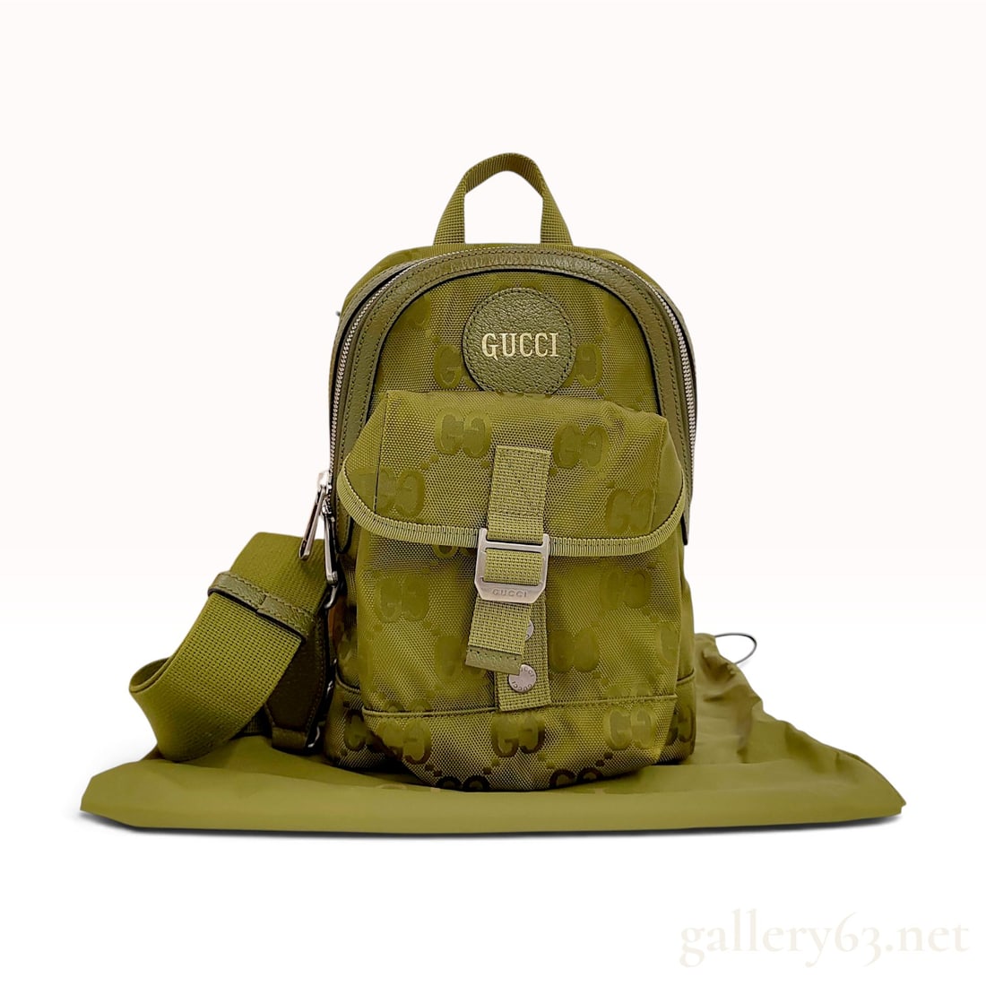 Gucci Off The Grid Olive Green Recycled Nylon Sling Backpack with Box: This Gucci Off The Grid sling backpack is crafted from olive green recycled nylon featuring the signature GG monogram pattern throughout. Part of the brand's sustainable collection, the bag is designe