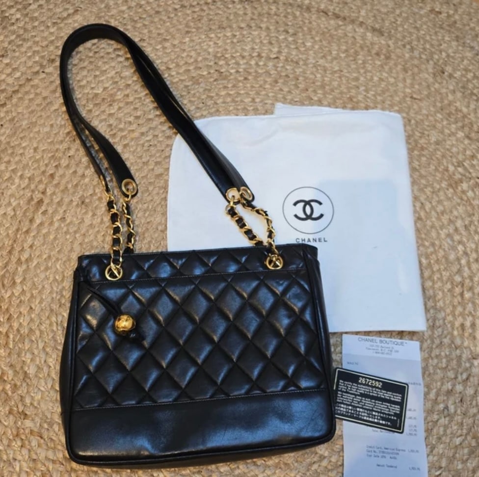 CHANEL VINTAGE QUILTED LAMBSKIN CHAIN SHOULDER TOTE, BLACK / GOLD: Vintage Chanel matelasse shoulder tote in black quilted lambskin with 24k gold-plated hardware. Diamond-quilted front and back panels over a smooth leather base band, twin leather-woven chain straps w