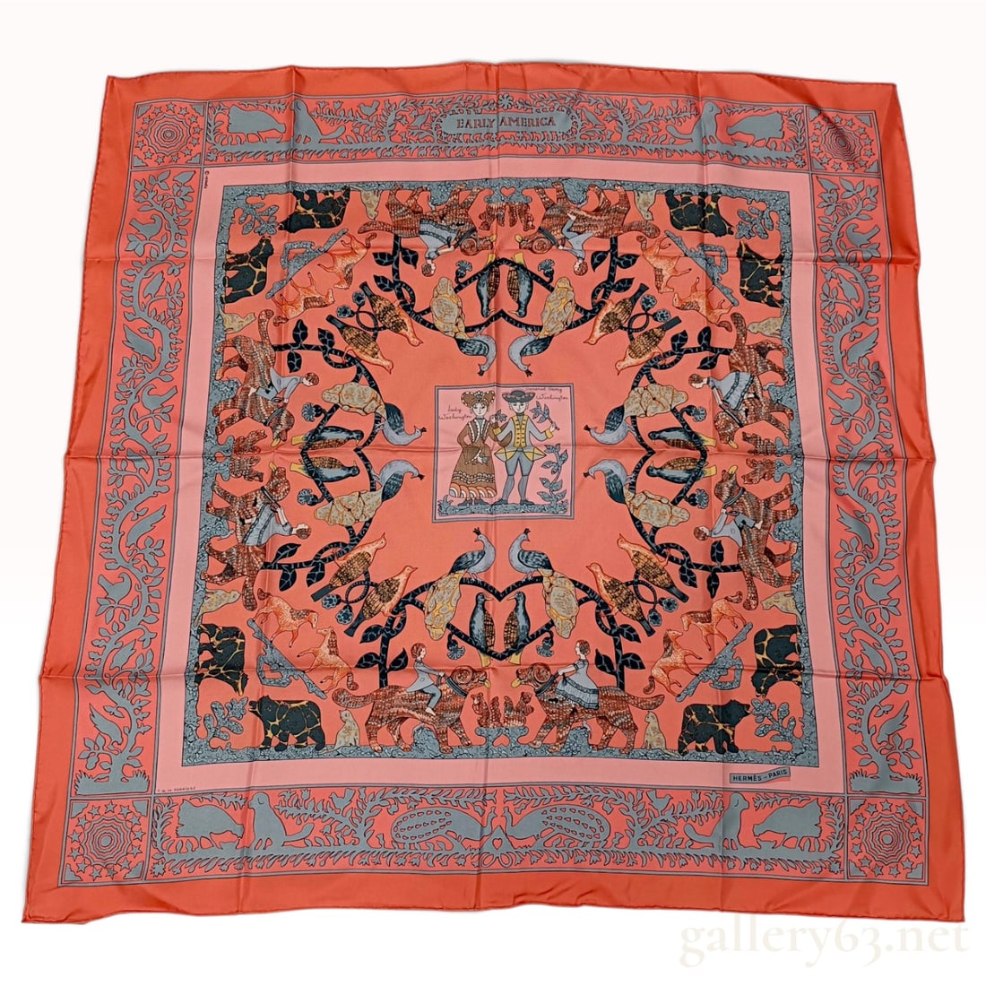A Vintage Hermes Early America Salmon Silk Carre 90 NWT: This Hermes silk carre 90 is crafted from silk twill in the Early America pattern by Carl de la Perriere. The design features a salmon-colored ground with a central medallion depicting Lady Washington