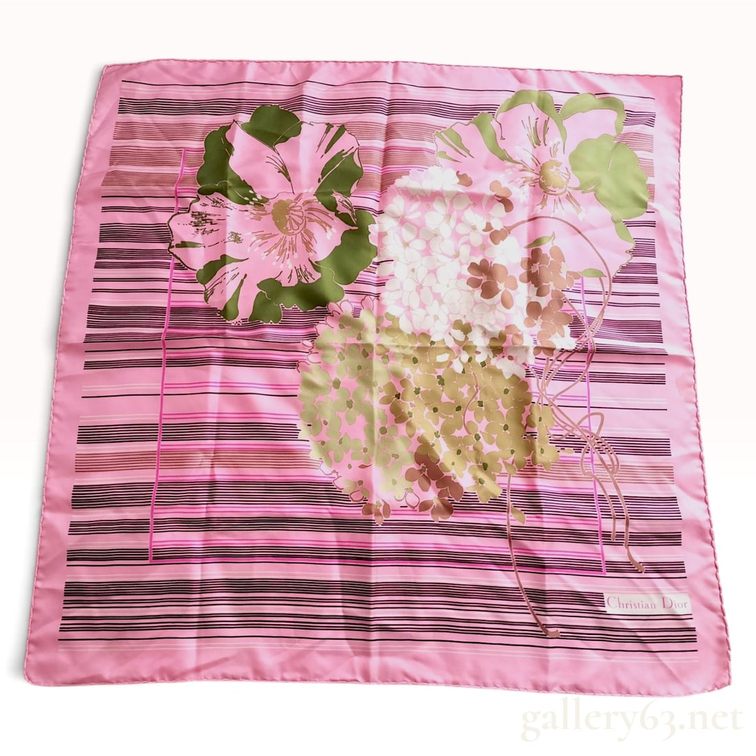Vintage Christian Dior Floral and Striped Pink Silk Scarf 80 cm: This vintage Christian Dior scarf is crafted from silk twill with a feminine floral and geometric design. The composition features a pink ground decorated with a large, offset floral motif including o