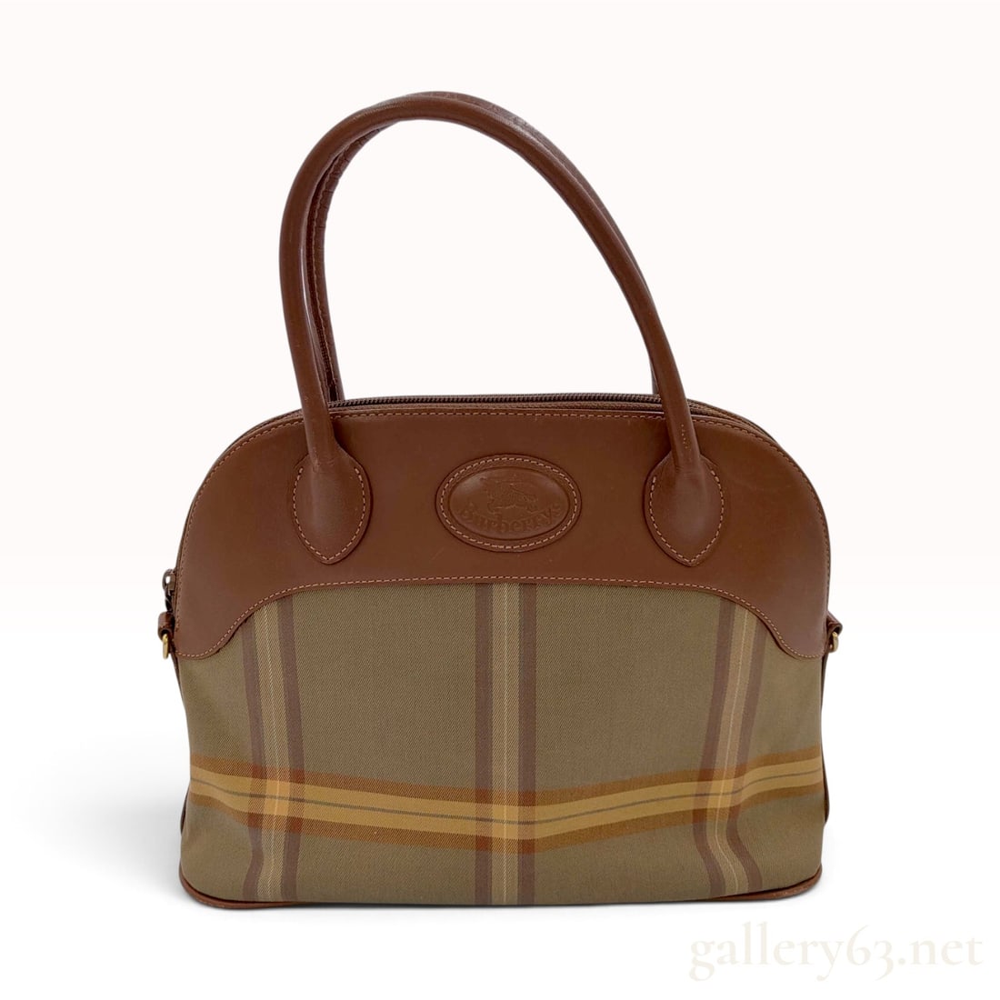 Vintage Burberrys Shadow Check Canvas and Brown Leather Domed Satchel: A vintage Burberrys domed satchel constructed from woven canvas and brown leather. The bag body features a tonal olive and brown shadow check pattern accented by horizontal mustard yellow stripes. The