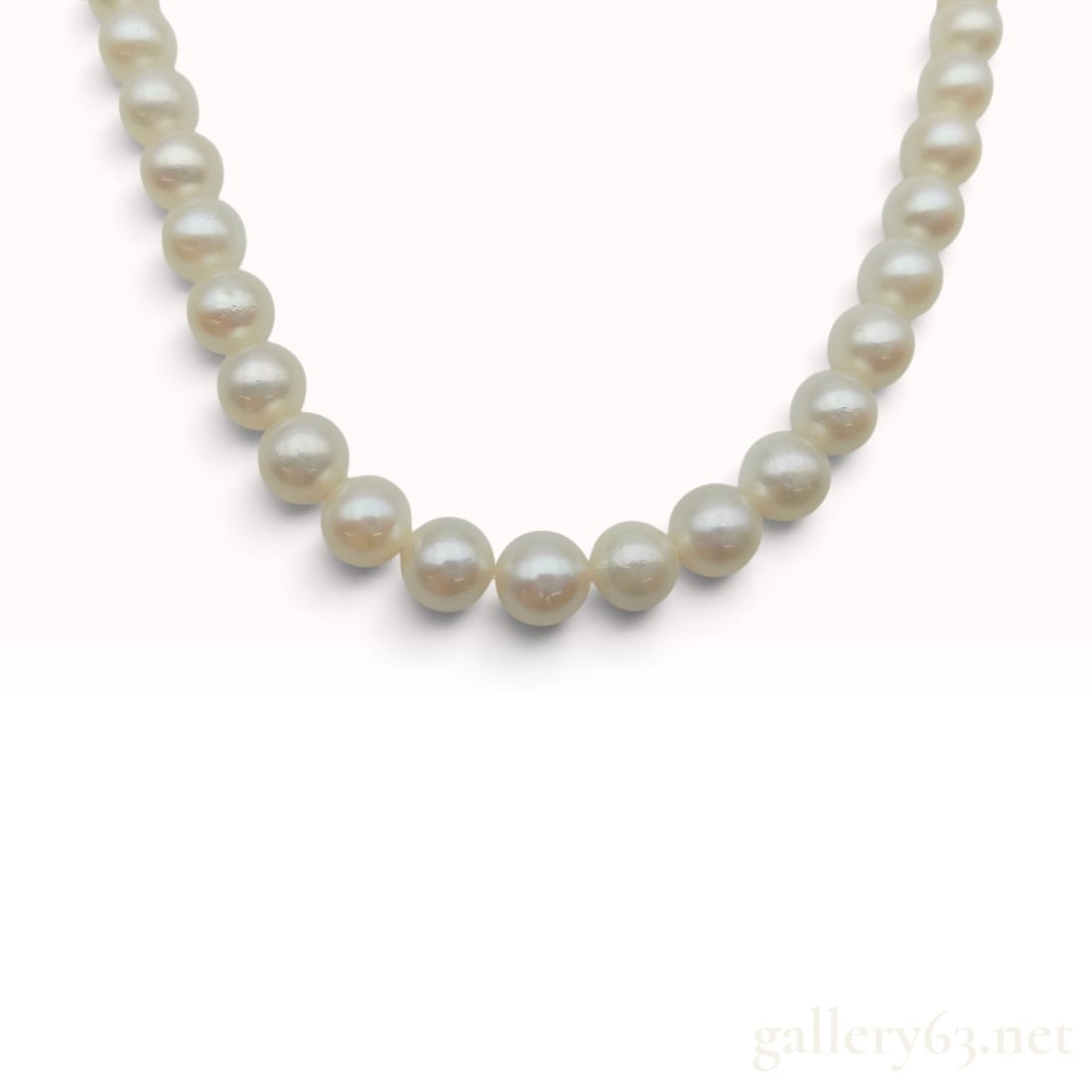 White 5.5mm-6.0mm Cultured Pearl and Silver Necklace 43 cm: This single-strand cultured pearl necklace is composed of approximately 70 round to near-round white pearls. The pearls exhibit high luster with subtle pink and cream overtones and measure between 5.5