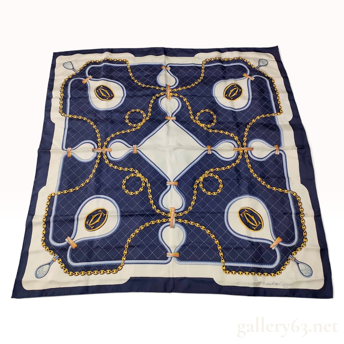 Vintage Cartier Double C Chain Navy Silk Scarf 90 cm: This French must de Cartier silk carre 90 is crafted from navy blue silk twill with hand-rolled edges. The central field features a tonal grid pattern overlaid with an intricate arrangement of interlo