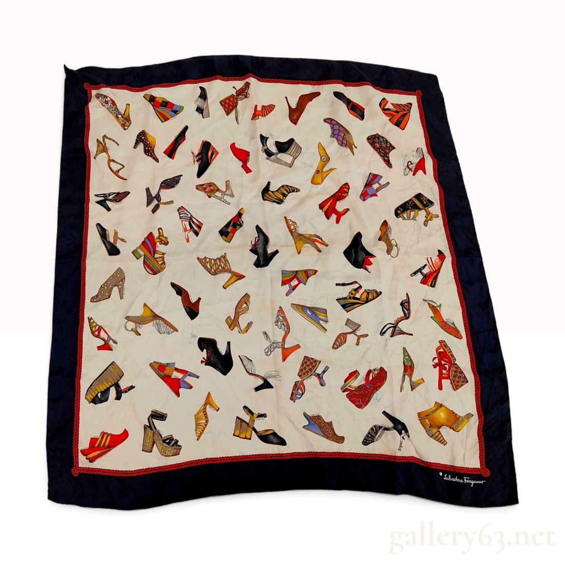 Vintage Salvatore Ferragamo Historical Shoe Print Navy and Cream Silk Carre 90: A vintage Salvatore Ferragamo silk carre 90 featuring a historical shoe print design on an ivory central field. The composition displays a chronological assortment of archival women's footwear designs