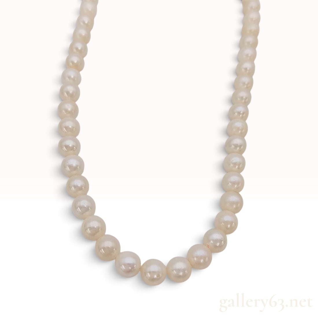 Vintage Silver and 6mm to 7mm Cultured Pearl Strand Necklace: This vintage single strand cultured pearl necklace is composed of approximately 58 round to near-round cultured pearls featuring a creamy-white body color and high luster. The pearls range in size fro