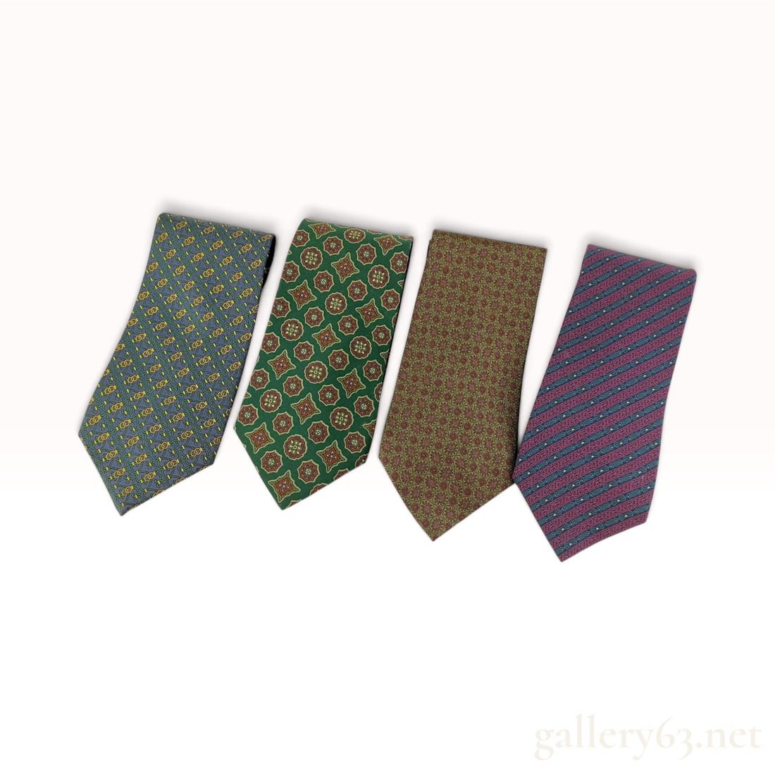 Vintage Christian Dior Monsieur Set of Four Silk Neckties: A set of Christian Dior Monsieur neckties crafted from silk. The collection features four distinct patterns: a blue ground with a green and yellow geometric lattice and ring motif; a dark green ground