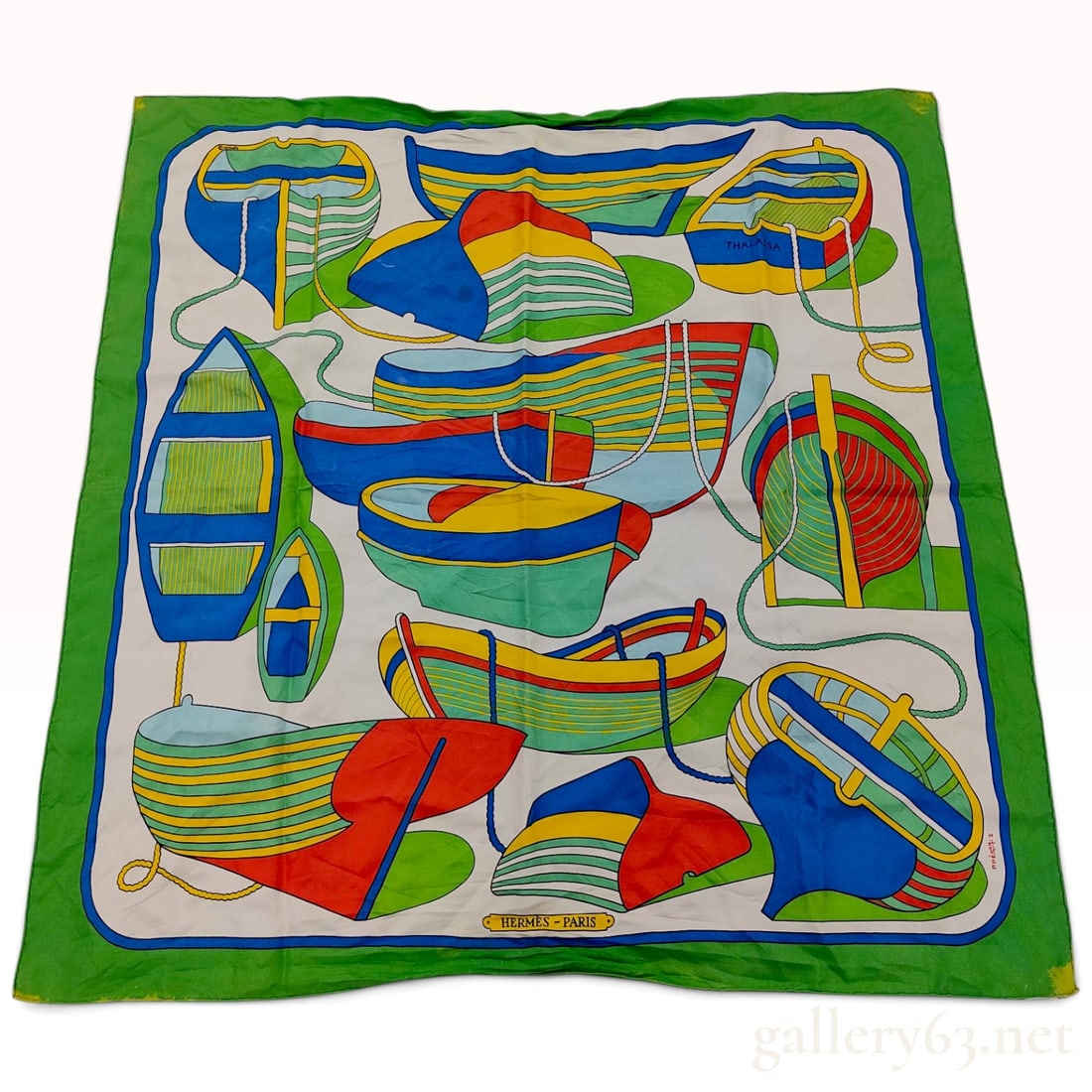 Vintage Hermes Thalassa Green Silk Carre 90: This vintage Hermes silk carre 90 features the Thalassa pattern designed by artist Pierre Peron, originally issued in 1973. The nautical composition illustrates an assortment of vibrant, stylized sail