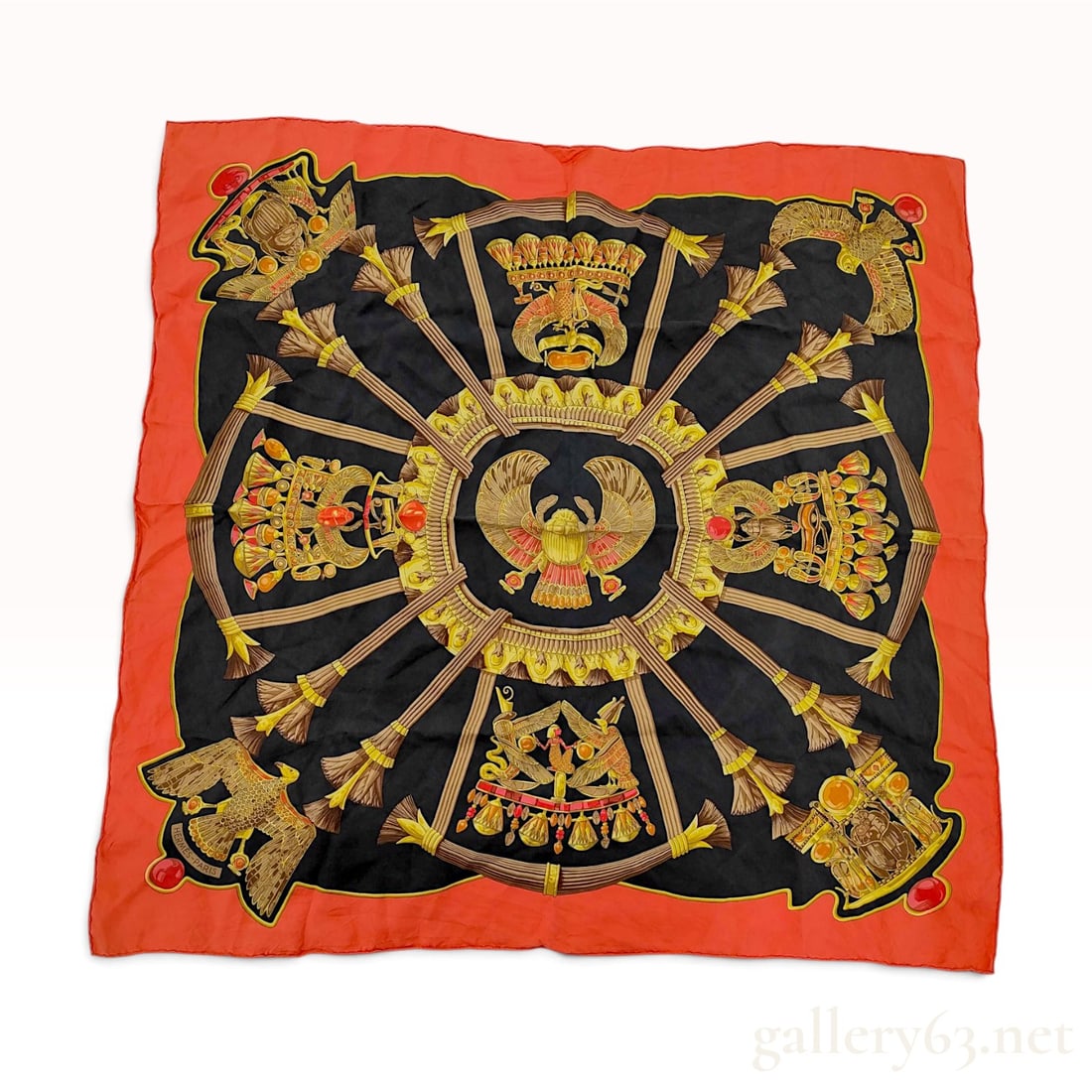 Vintage Hermes Egypte Black and Orange Silk Carre 90: A vintage Hermes silk carre 90 in the Egypte pattern designed by Loic Dubigeon. The composition features ancient Egyptian motifs including a central winged scarab and pharaonic pectorals, flanked by l