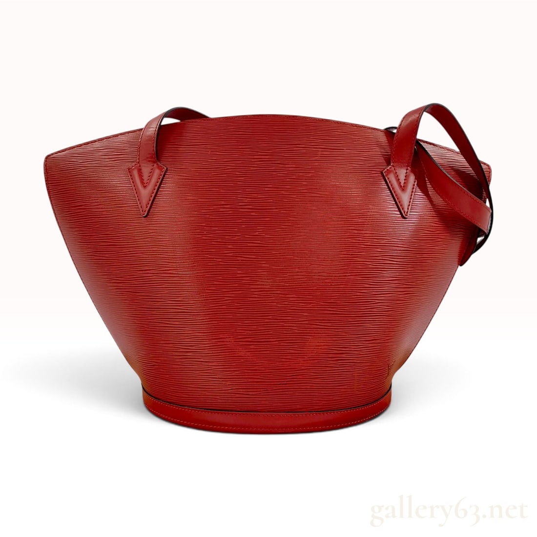 Vintage Louis Vuitton Saint Jacques Red Epi Leather Tote Bag: This Louis Vuitton Saint Jacques shopping tote is crafted from red Epi leather featuring a distinctive horizontal textured grain. The bag has a fan-shaped silhouette with smooth red leather shoulder s