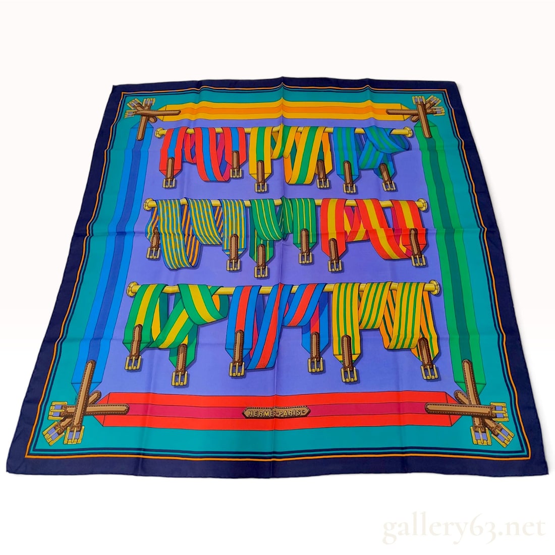 Vintage Hermes Les Sangles Silk Carre 90: This Hermes silk carre 90 is crafted from silk twill and features the Les Sangles (The Straps) pattern designed by Joachim Metz. The design is centered on a periwinkle blue ground and depicts multiple