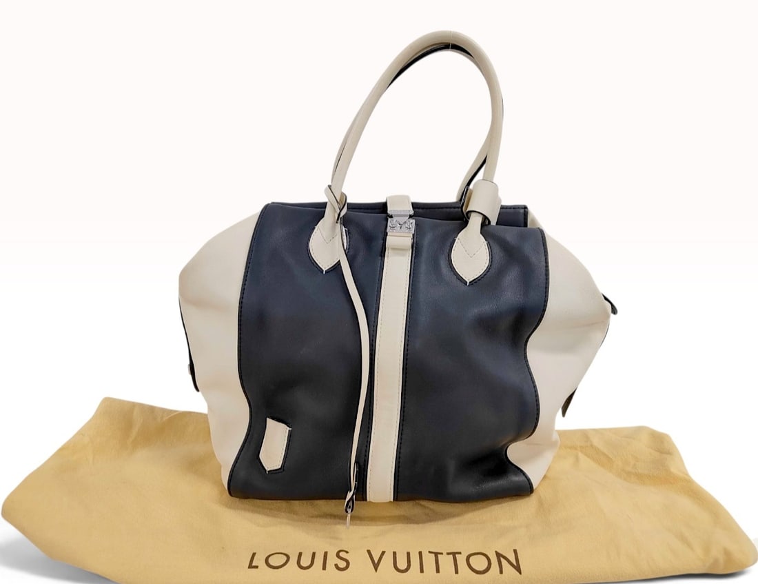 C. 2012 Louis Vuitton Suship Speedy North South Bicolor Leather Tote Bag with Dust Bag: A Louis Vuitton Suship Speedy North-South tote bag from the Spring-Summer 2012 runway collection. The bag is constructed from smooth bicolor calfskin leather in black and cream panels featuring tonal 