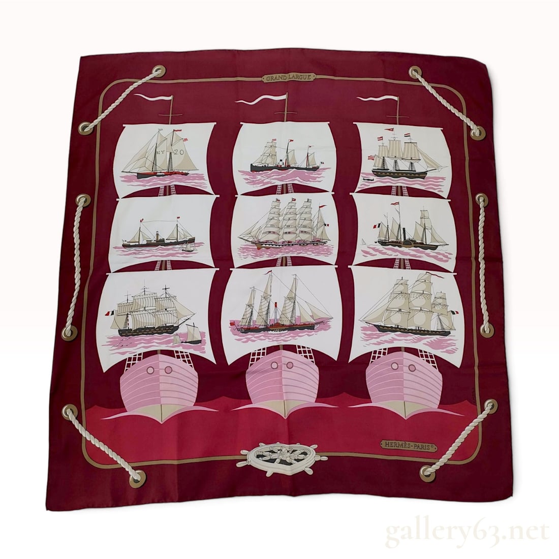 Vintage Hermes Grand Largue Burgundy Silk Carre 90: This Hermes silk carre 90 in the Grand Largue pattern was designed by artist Pierre Peron and originally issued in 1974. The maritime design features nine detailed illustrations of historical sailing 