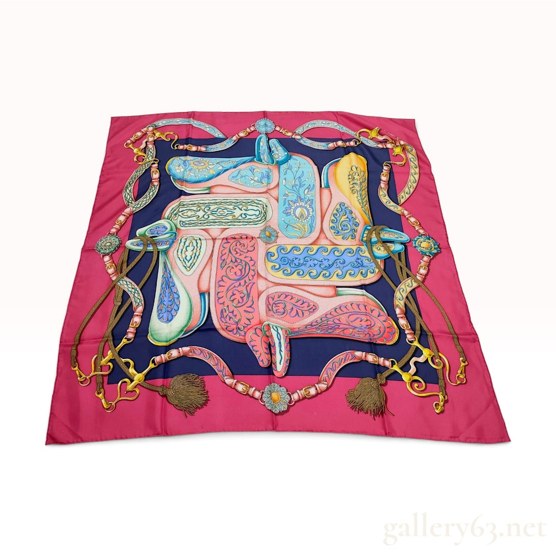 Vintage Hermes Festival Silk Carre 90: This Hermes silk carre 90 features the Festival pattern designed by Henri d'Origny. The equestrian-themed design presents a symmetrical arrangement of four interlocking horse saddles with intricate fl