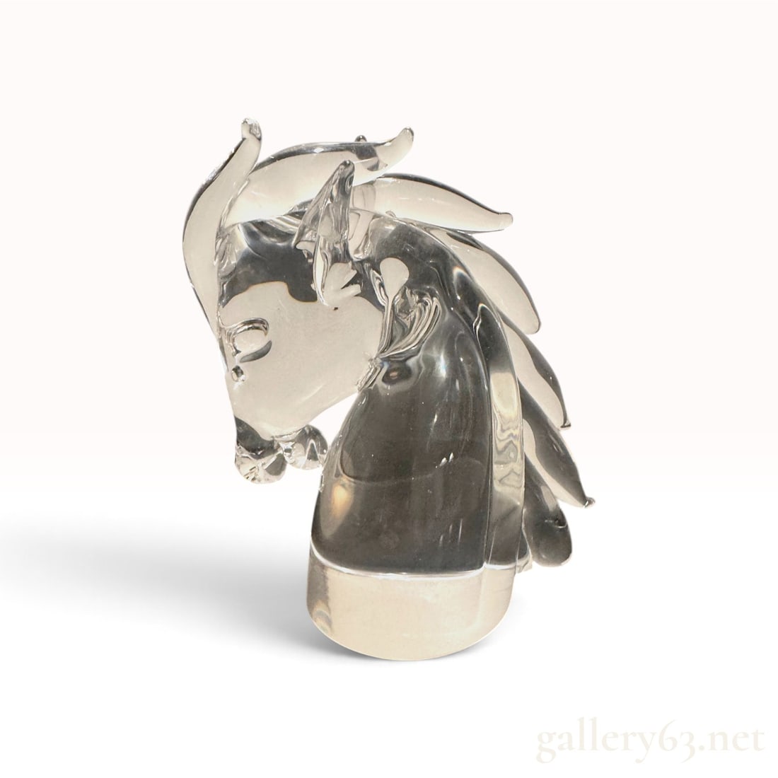 Cartier Crystal Horse Head Sculpture -- Signed, Free-Form Sculpted Mane: A Cartier crystal sculpture modelled as a horse's head, executed in solid clear crystal. The piece is hand-worked rather than moulded: the mane is pulled and drawn into free-form strands that sweep ba