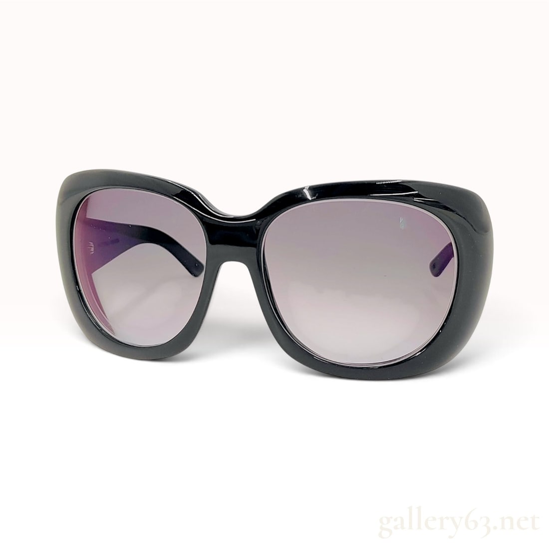 Bottega Veneta BV 42/S Black Acetate Oversized Sunglasses: These Bottega Veneta BV 42/S sunglasses are crafted from glossy black acetate in an oversized butterfly silhouette. The frames feature a rounded rectangular shape housing gray-to-clear gradient tinted