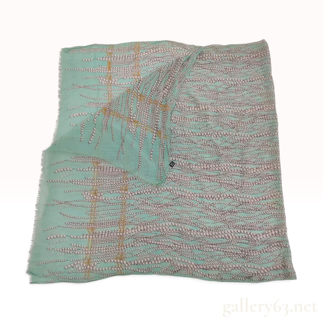 Bottega Veneta Pearl and Lattice Motif Mint Green Silk Scarf 90 cm: This Bottega Veneta scarf is crafted from 100% silk gauze featuring a delicate, sheer weave. The design depicts cascading multi-strand grey and white pearls of varying sizes draped over a gold-toned l