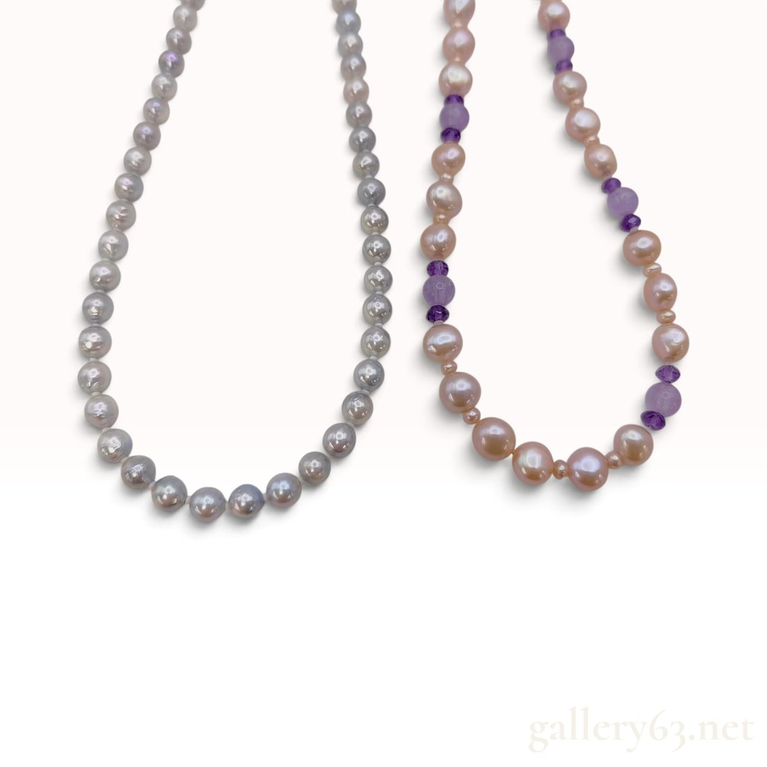 Two Cultured Freshwater Pearl and Amethyst Beaded Strands: Two beaded necklaces crafted from cultured freshwater pearls and amethyst beads. One strand contains grey pearls, approximately 6mm to 7mm in diameter, exhibiting semi-round to baroque shapes and mode