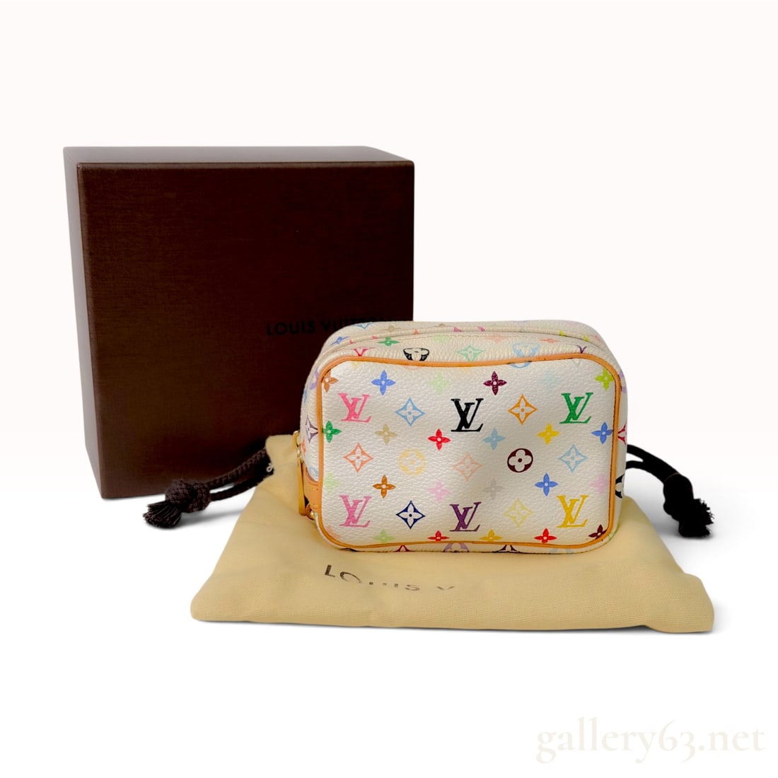Louis Vuitton Monogram Multicolore White Coated Canvas Trousse Wapity Pouch with Box: A Louis Vuitton Trousse Wapity pouch from the Monogram Multicolore collection, a collaboration with artist Takashi Murakami. The exterior is constructed from white coated canvas decorated with the ico