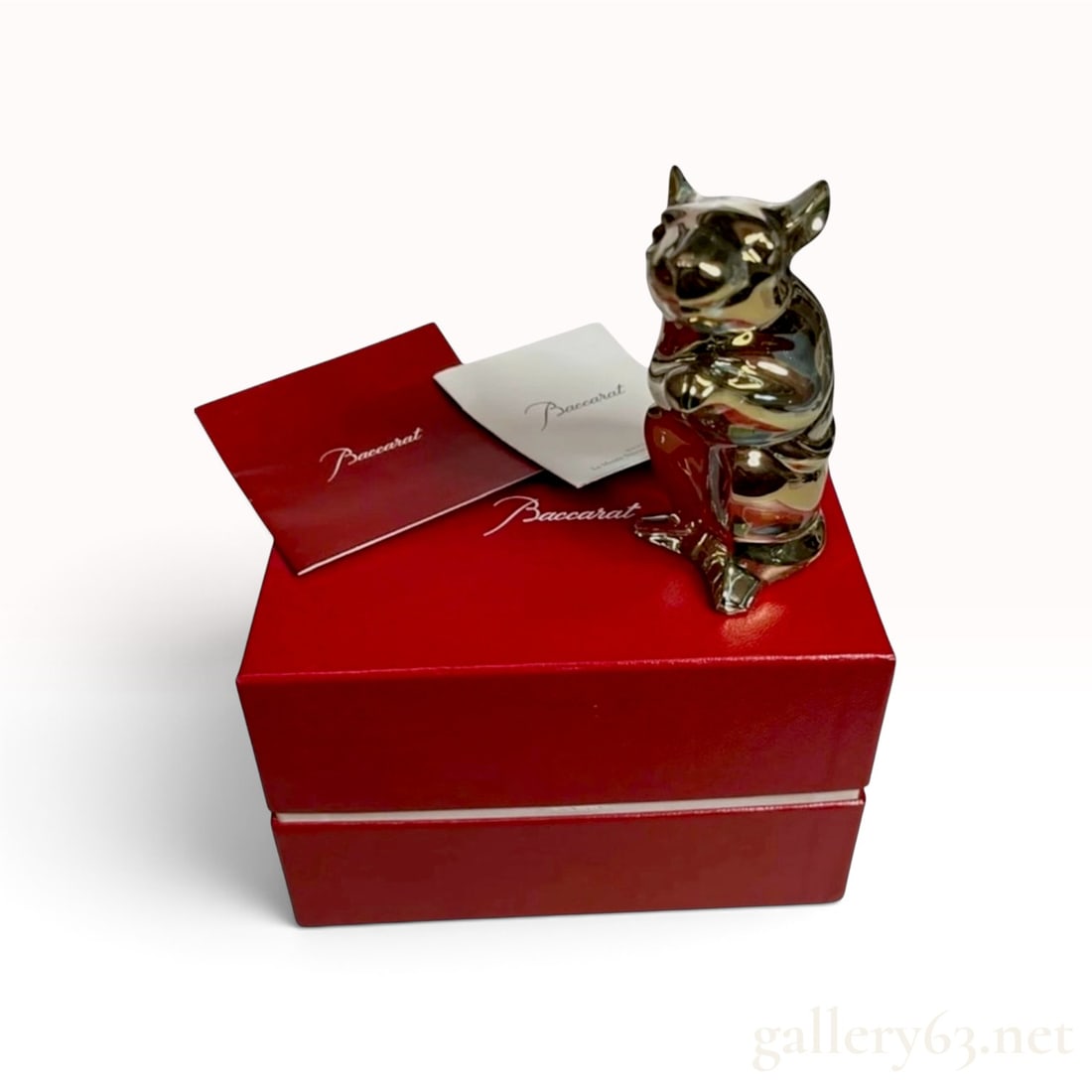 BACCARAT (French) -- 'Zodiac' Gold Crystal Rat, 2020 Year of the Rat, No. 2813062, with Original Box: From Baccarat's annual Zodiac series, issued for the 2020 Year of the Rat. The figure is modeled seated upright on its haunches with forepaws raised and head lifted, the whole rendered in Baccarat's w