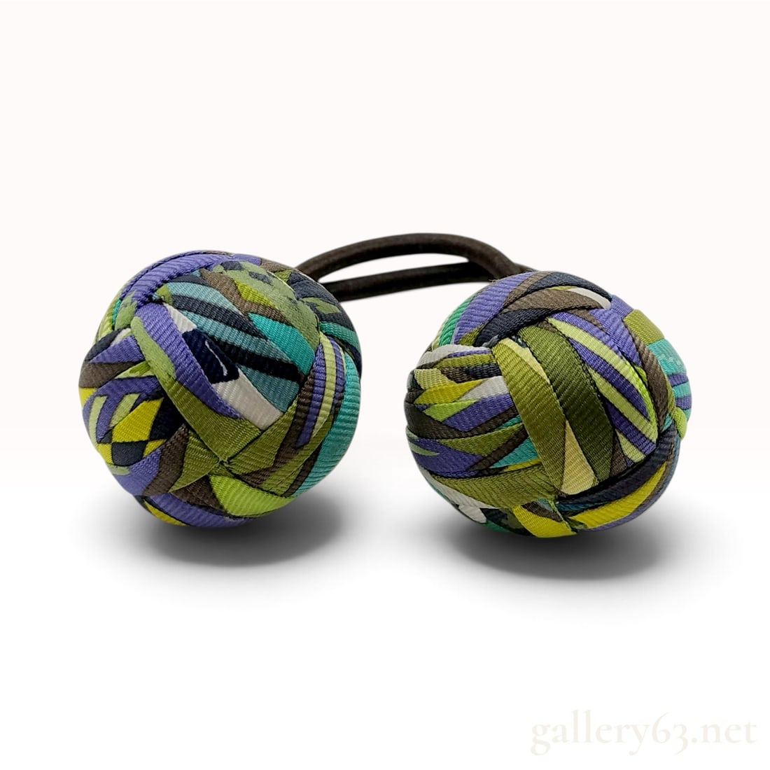 A Pair of Hermes Pompon Abstract Multi-Color Silk Hair Ties with Box: A pair of Hermes hair ties, commonly referred to as pompon chouchous, featuring decorative spherical ornaments crafted from interwoven strips of silk twill. Each ornament is constructed using a monkey