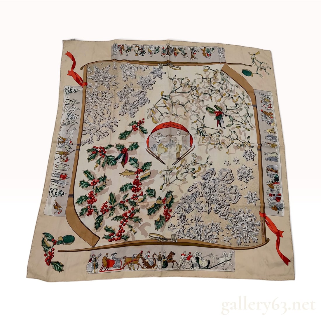 Vintage Hermes Neige d Antan (Snows of Yesteryear) Silk Carre 90: A vintage Hermes silk carre 90 in the Neige d Antan (Snows of Yesteryear) pattern designed by Caty Latham. The winter-themed motif features a central couple skiing under a red banner reading Neige d A