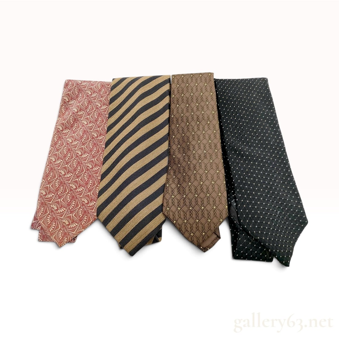 A Collection of Fendi Armani and Hermes Silk and Wool Blend Neckties: This collection of designer neckties includes examples from Fendi, Giorgio Armani, Emporio Armani, and Hermes crafted from silk and wool-silk blends. The Fendi necktie features a terracotta silk geome