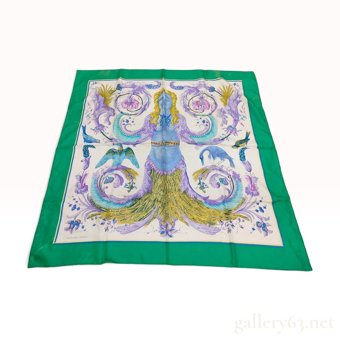 Vintage Hermes Ceres Silk Carre 90: This vintage Hermes silk carre 90 features the Ceres pattern designed by Francoise Faconnet. The central motif depicts the Roman goddess of agriculture with a blue scaled torso and a skirt composed of
