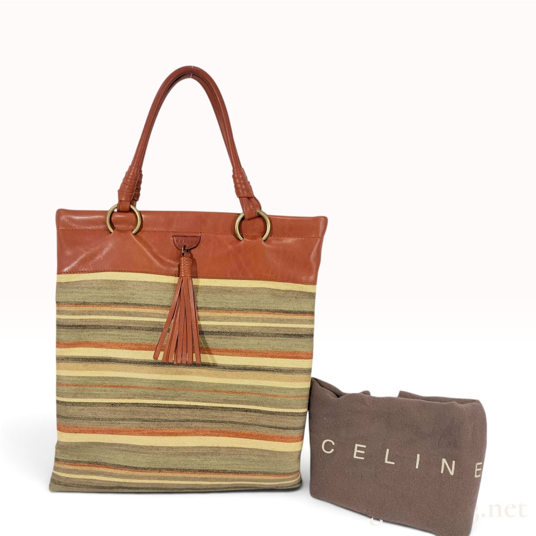 Vintage Celine Border Striped Multicolor Canvas and Leather Tote Bag with Dust Bag: This Celine tote bag is constructed from a striped woven canvas with smooth cognac-colored leather trim and handles. The exterior design consists of horizontal stripes in shades of olive, burnt orange