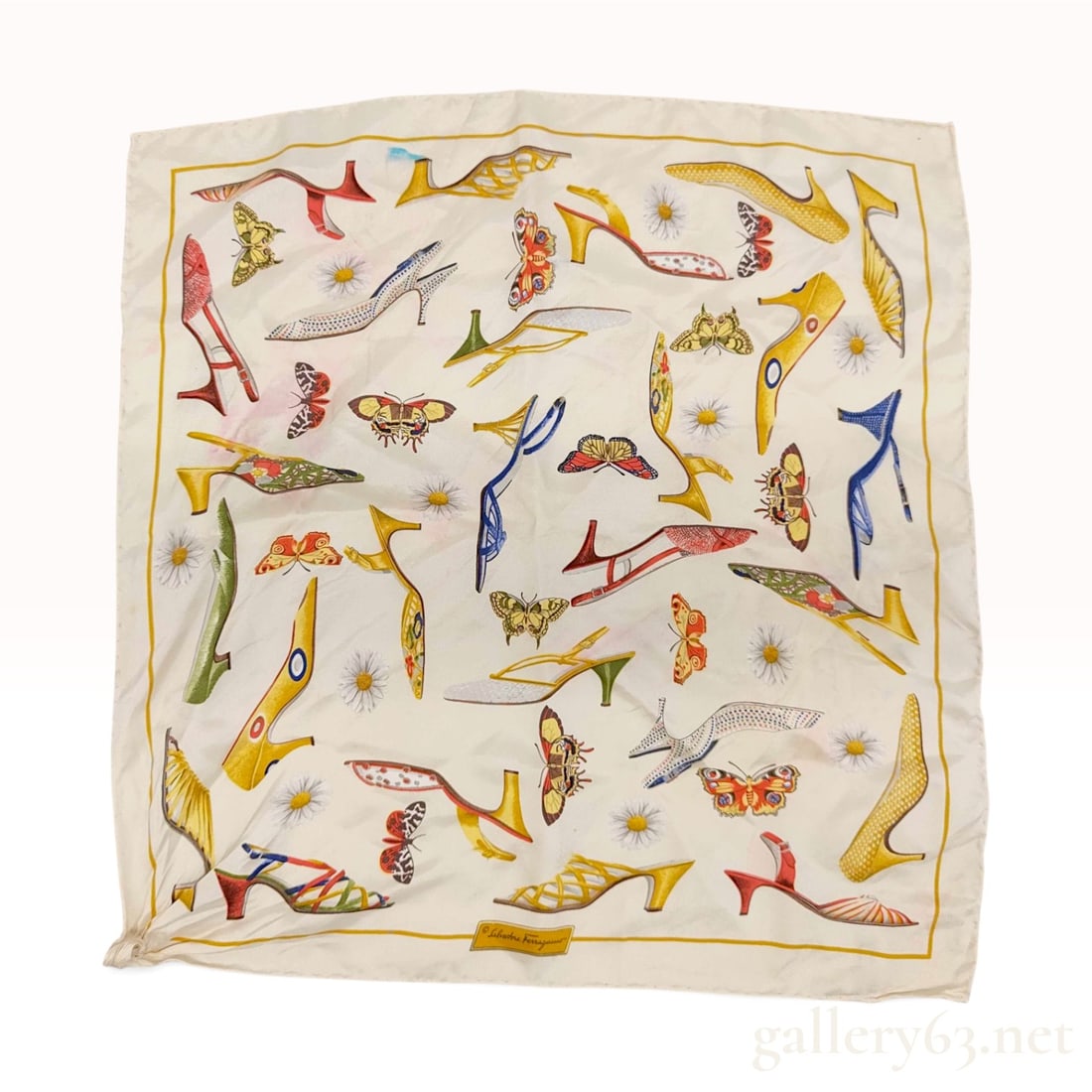 Vintage Salvatore Ferragamo Shoe and Butterfly Motif Cream Silk Scarf 42 cm: This Salvatore Ferragamo silk scarf is crafted from cream silk and features a motif of illustrated high-heeled shoes, butterflies, and daisies. The shoe designs include various heel types and patterns