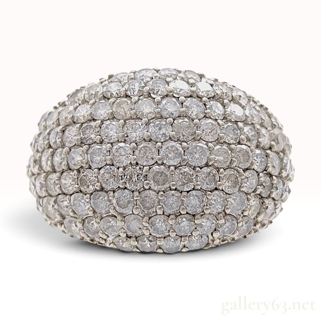 Pt900 Platinum and 3.00ctw Natural Diamond Pave Dome Cocktail Ring: This Pt900 platinum and natural diamond cocktail ring is designed with a large pave-set dome head. The setting is encrusted with round brilliant-cut natural diamonds totaling 3.00ctw, arranged in a de