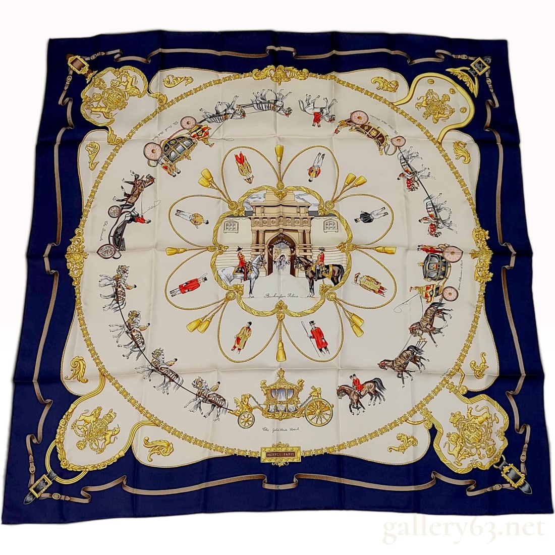 Vintage Hermes The Royal Mews Navy and Cream Silk Carre 90: This Hermes silk carre 90 features The Royal Mews pattern. The central composition depicts the entrance to the Royal Mews at Buckingham Palace, surrounded by a circular arrangement of vignettes showin