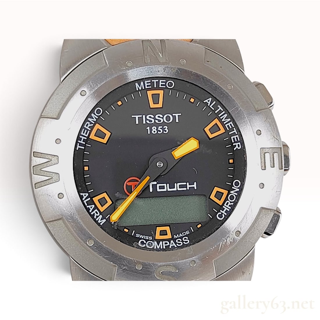 Tissot T-Touch Z 253/353 Stainless Steel Orange Rubber Strap Wristwatch: This Tissot T-Touch wristwatch is crafted from stainless steel and features an integrated orange rubber strap. The black dial presents six touch-sensitive zones labeled METEO, ALTIMETER, CHRONO, COMPA