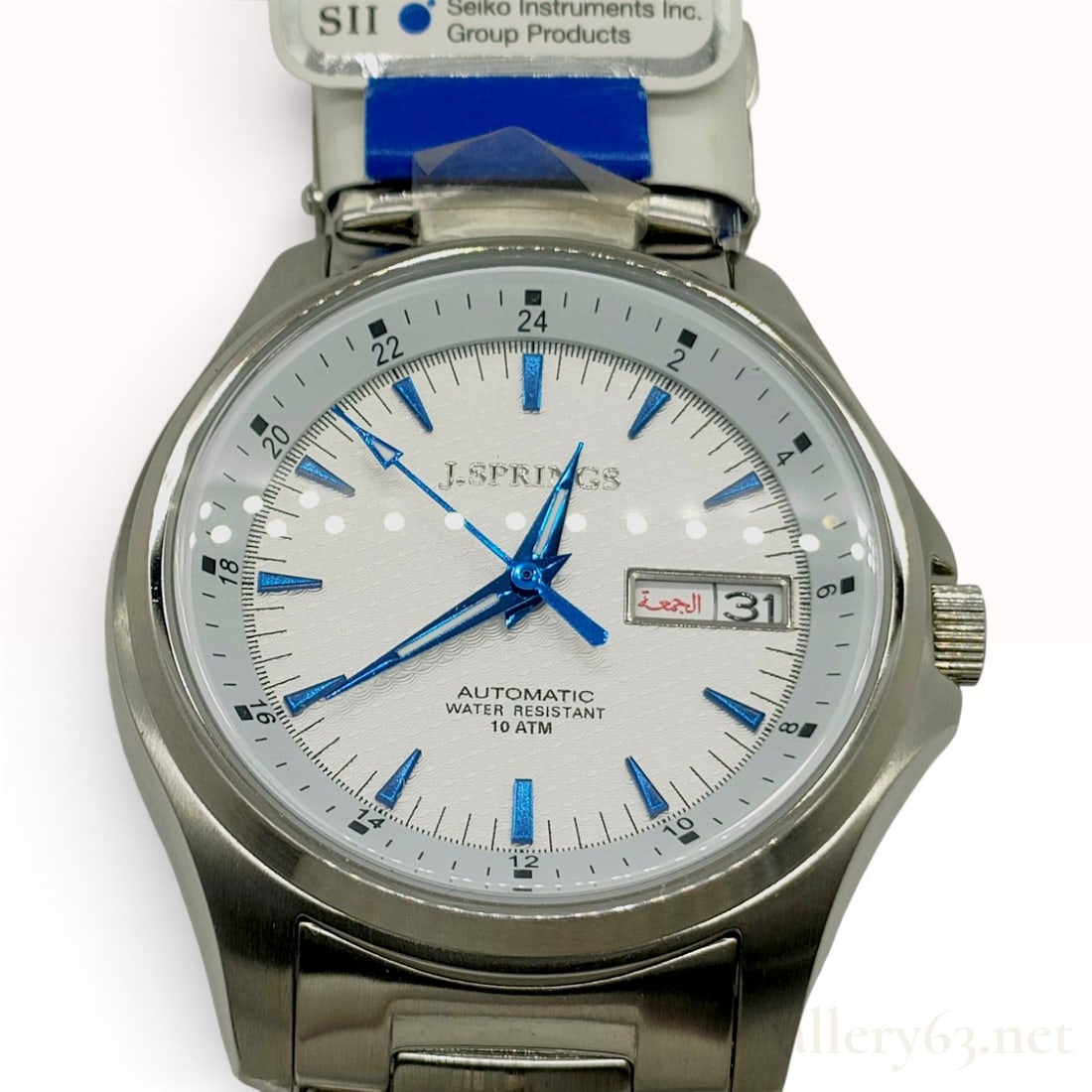 J.SPRINGS BEB014 White Dial Stainless Steel Automatic Wristwatch New With Tags: A J.SPRINGS BEB014 automatic wristwatch featuring a stainless steel case and a textured white dial. The dial is detailed with applied blue baton hour markers, blue luminescent hands, and an inner 24-h