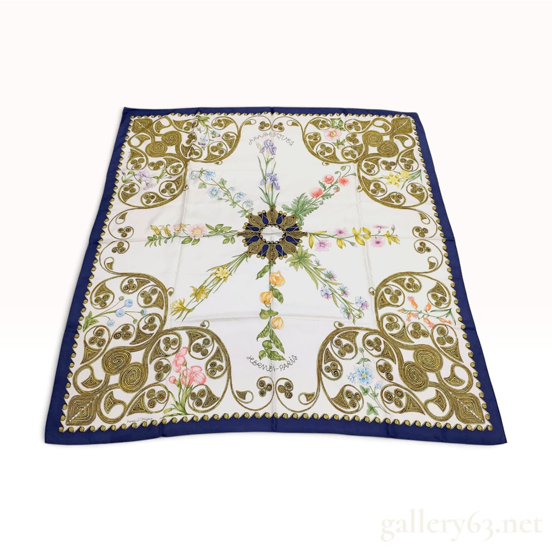 Vintage Hermes Arabesques White Silk Carre 90: This Hermes silk carre 90 is crafted from white silk twill featuring the Arabesques pattern designed by Henri d'Origny. The design centers on a botanical display of irises, poppies, and cornflowers ra