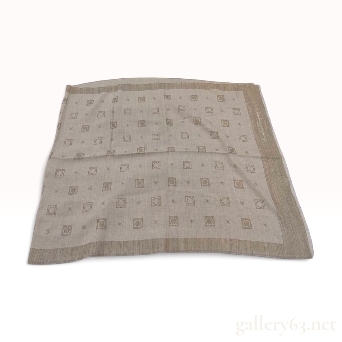 Vintage Salvatore Ferragamo Gancini Monogram Beige Silk Wool Scarf 95cm with Box: This Salvatore Ferragamo square scarf is crafted from a neutral beige silk and wool blend. The textile features a repeating jacquard pattern of the signature Gancini logo enclosed in squares, interspe