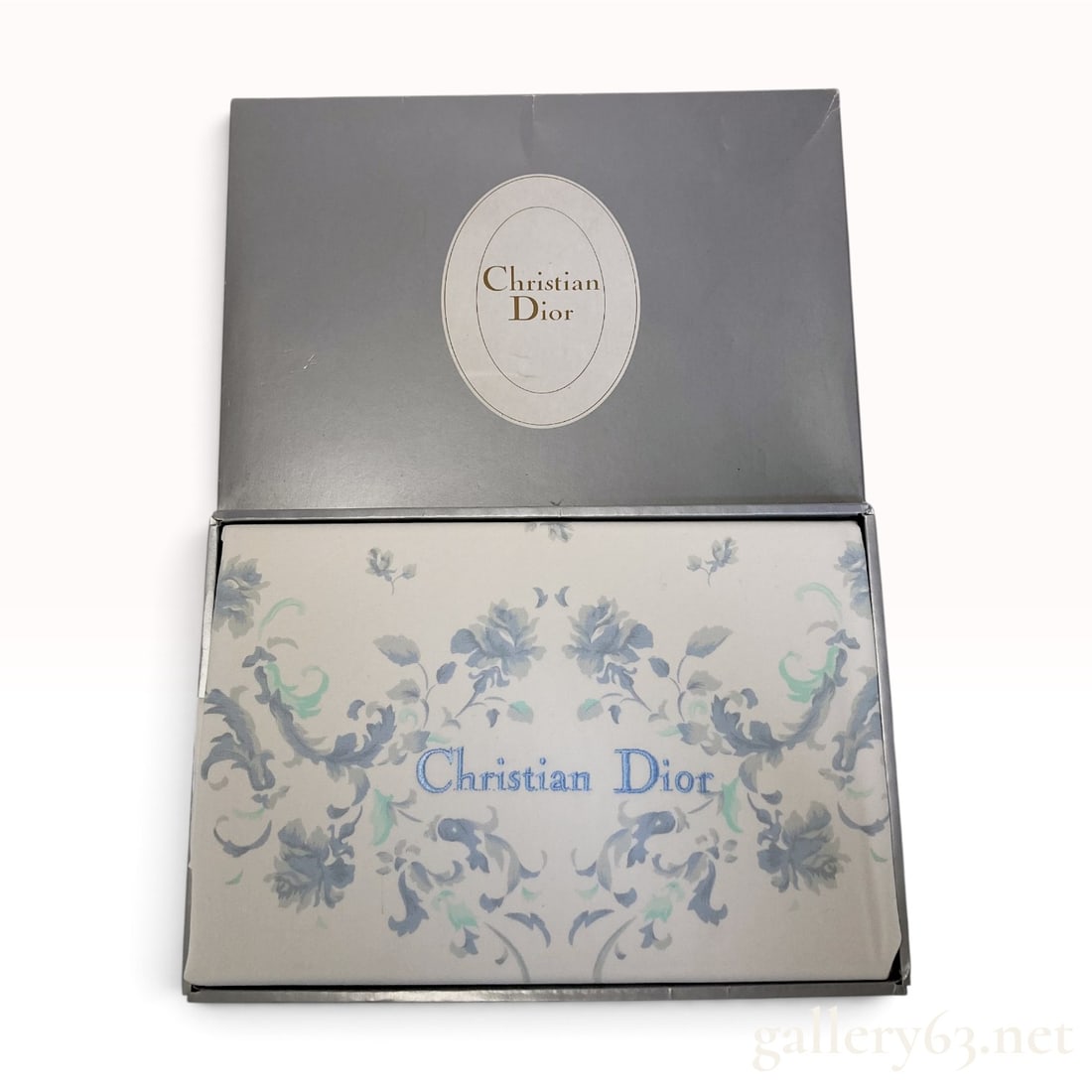 Christian Dior Floral Blue and Green 100% Cotton Flat Sheet with Box: This Christian Dior flat bed sheet is crafted from 100% cotton and features a floral damask or toile-style pattern. The design incorporates rose and acanthus leaf motifs in shades of blue and seafoam 