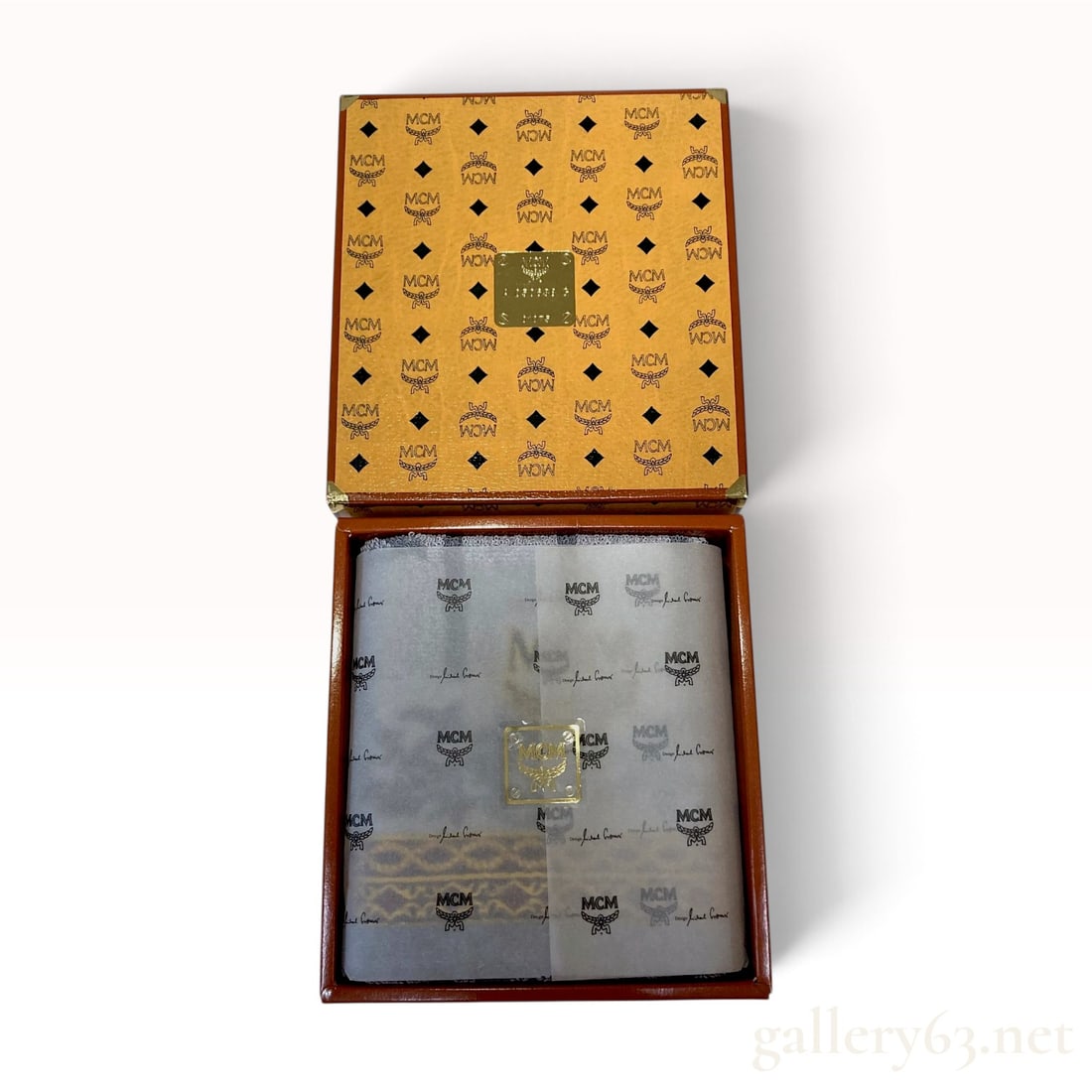 Vintage MCM Visetos Boxed Grey Cotton Terry Towel Set with Box: This MCM towel set is housed in a square orange-tan cardboard gift box featuring the signature Visetos monogram pattern. The box is reinforced with gold-toned metal corner protectors. The interior lid