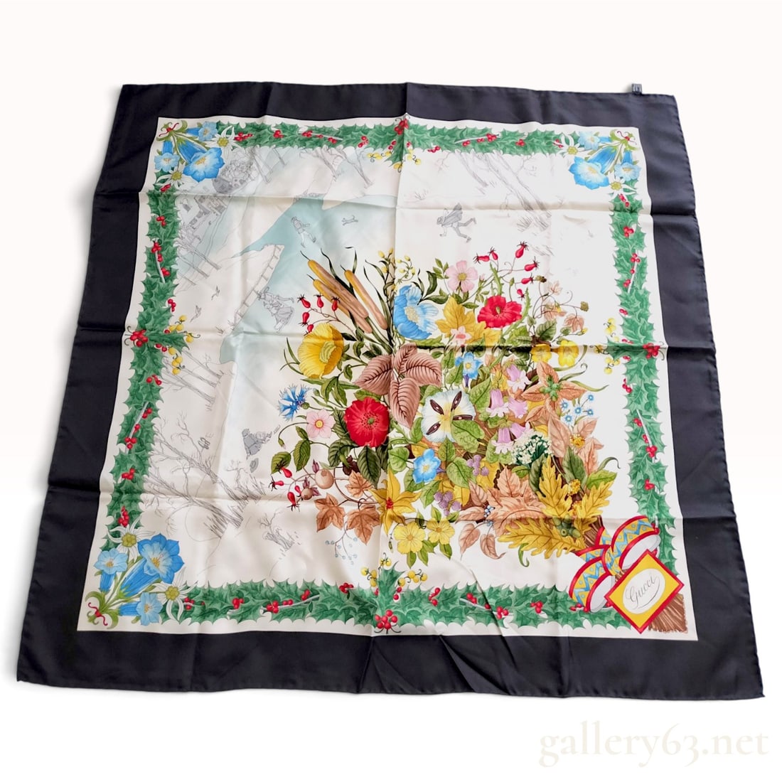 Vintage Gucci Winter Flora Navy Blue Silk Scarf 90 cm: This is a Gucci silk scarf in the Winter Flora pattern designed by Vittorio Accornero. It is crafted from 100% silk with hand-rolled and hand-stitched hems. The central motif features a polychrome bou